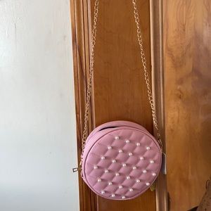 Pink circle purse.